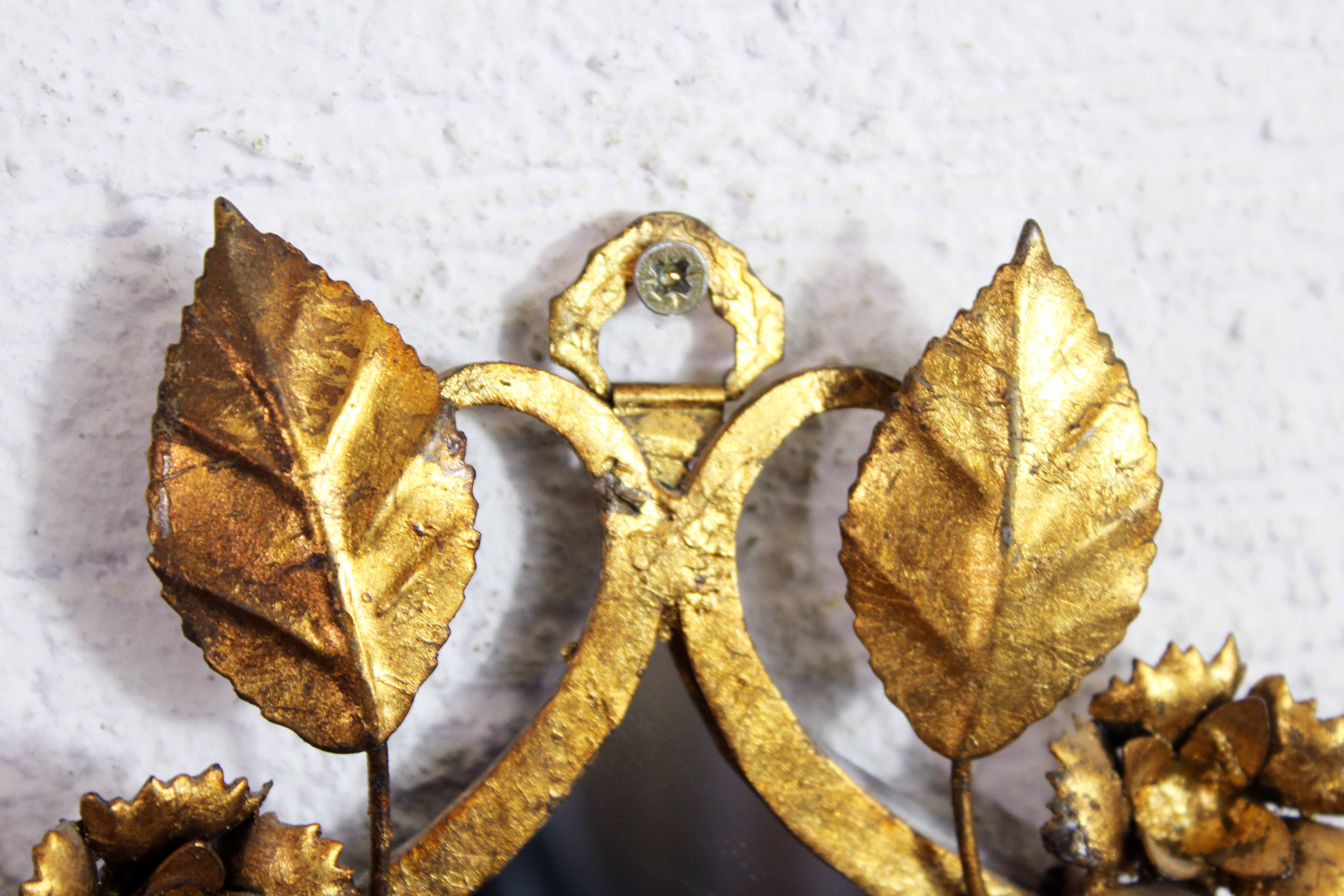 Old candlestick mirror gilded with leaf