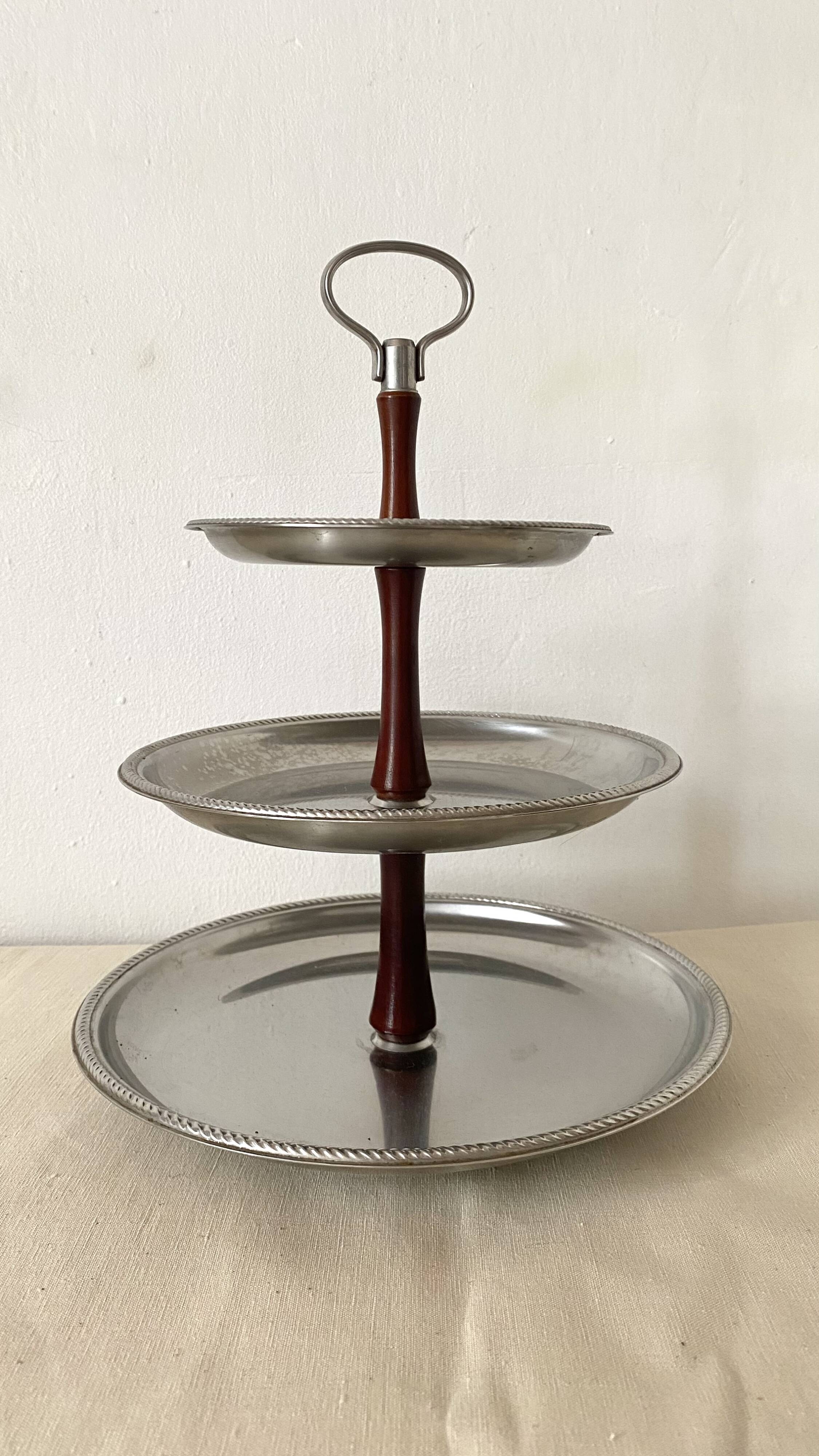 Vintage tiered display stand, stainless steel rotating server Alessi Fratelli