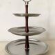 Vintage tiered display stand, stainless steel rotating server Alessi Fratelli