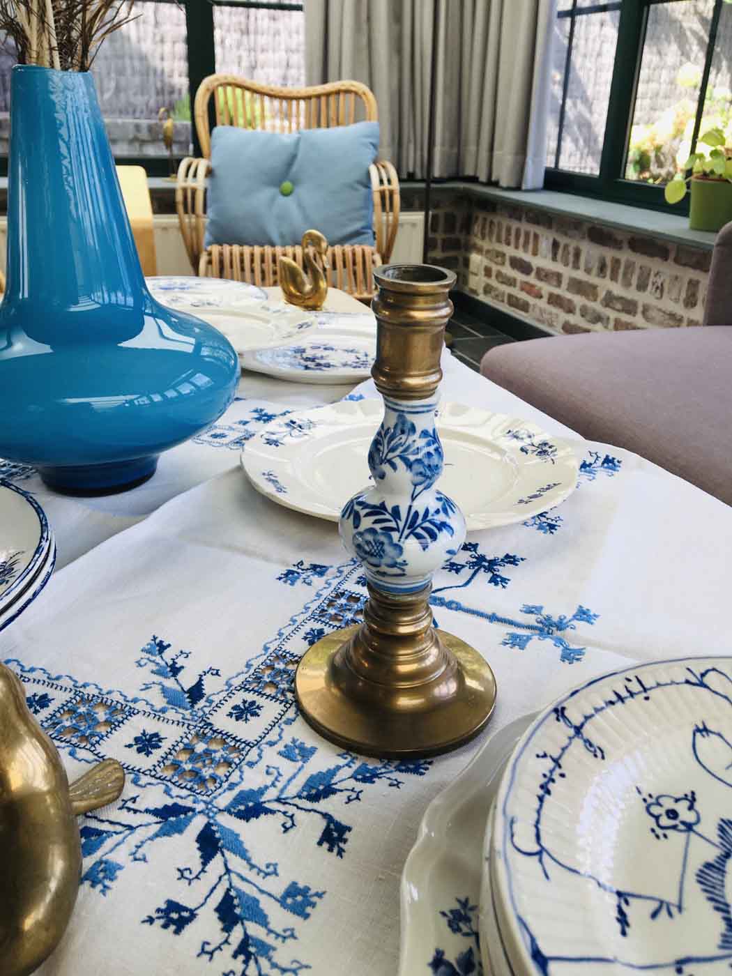 Delft brass and porcelain candlestick duo