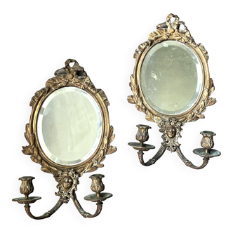 Paire d'appliques miroirs avec bougeoirs en bronze du XIXème .