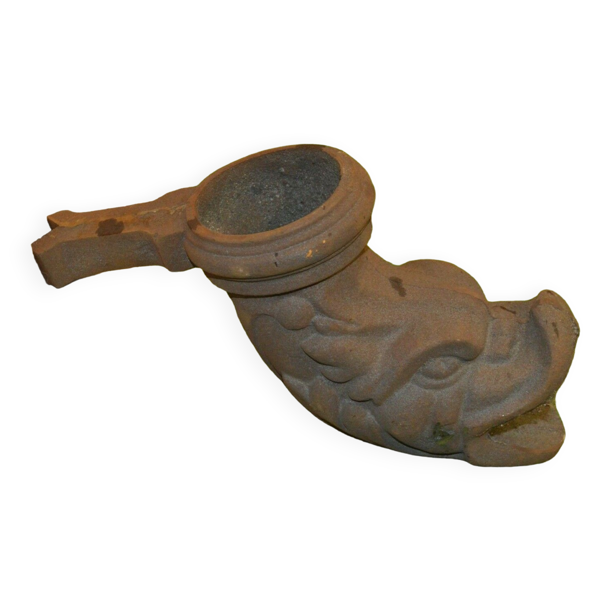 Cast iron gutter downspout in the shape of a dolphin