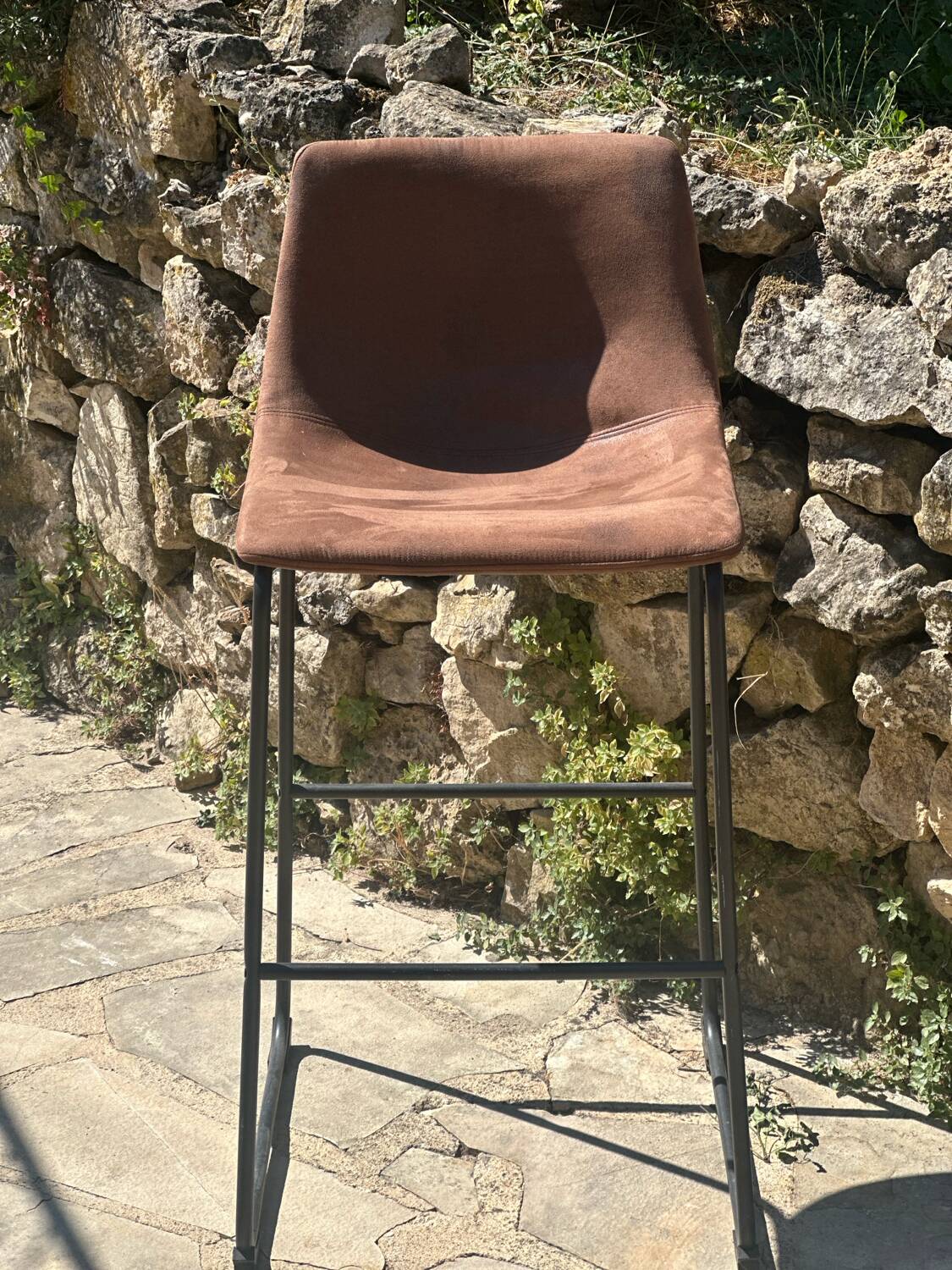 Bar stool in metal and aged leather