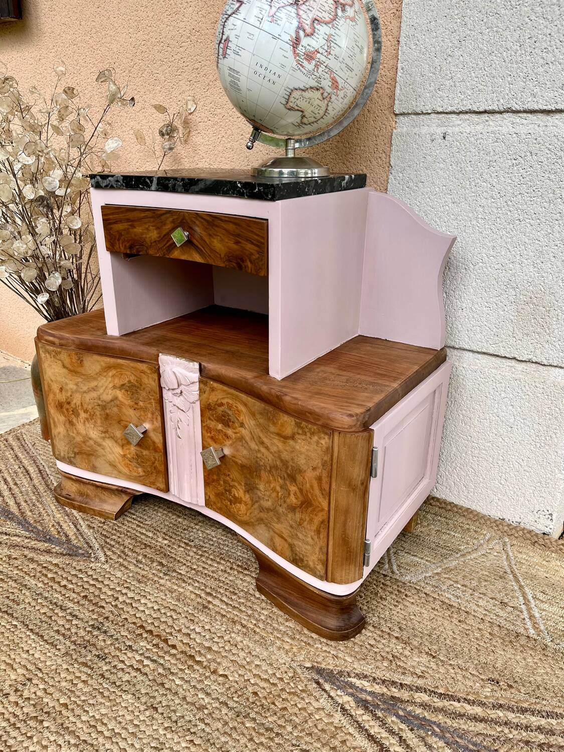 Art Deco bedside table in powder pink painted wood.