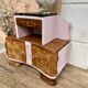 Art Deco bedside table in powder pink painted wood.