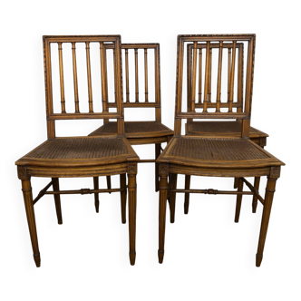 Set of four Louis XVI style chairs in carved wood.