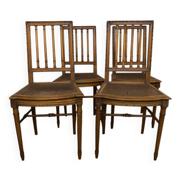 Set of four Louis XVI style chairs in carved wood.