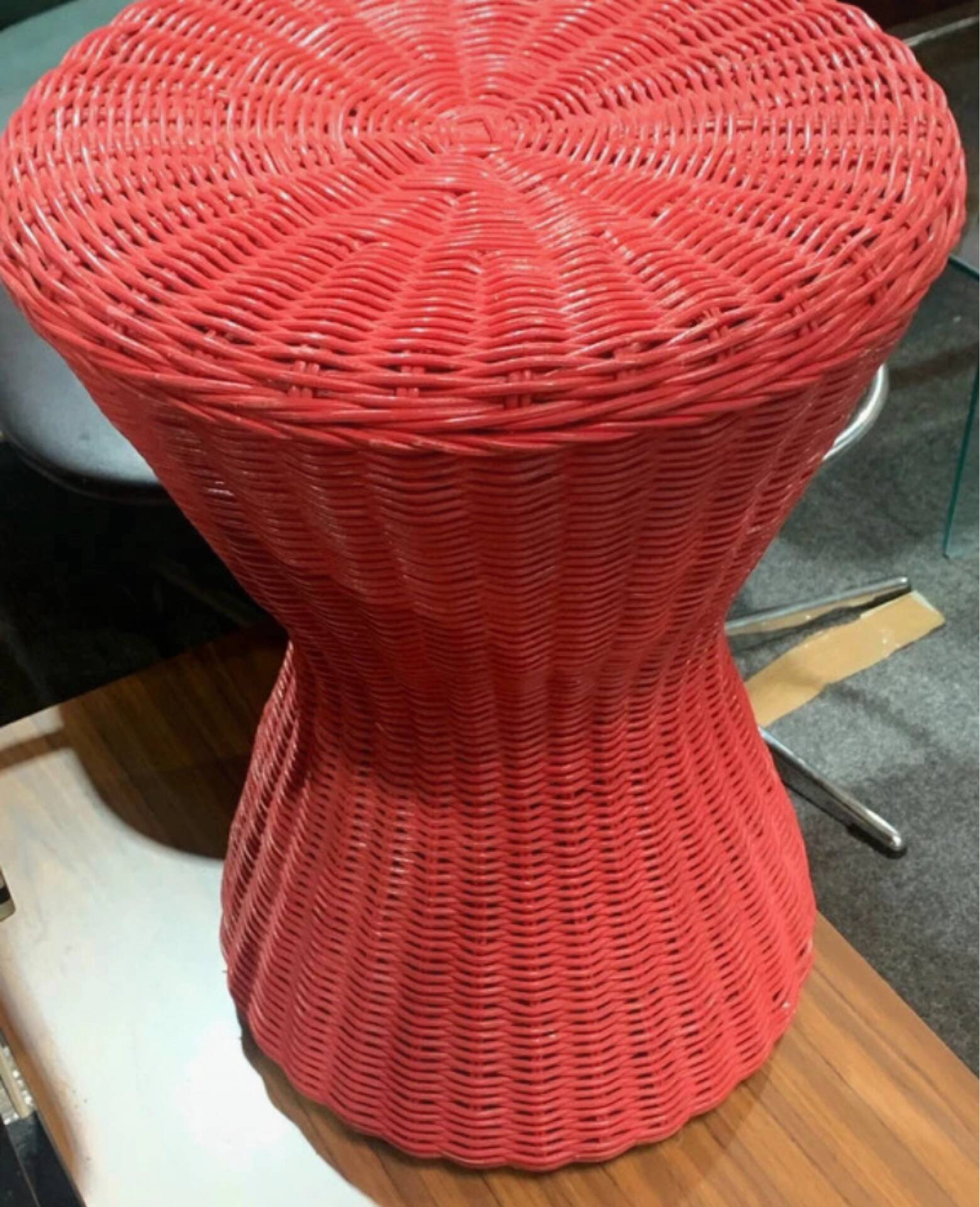 Vintage hourglass stool in red wicker or woven rattan.