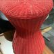 Vintage hourglass stool in red wicker or woven rattan.