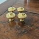4 polished brass furniture knobs