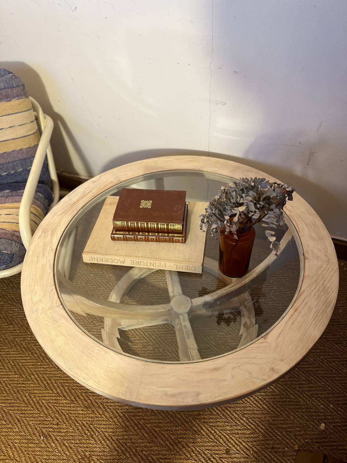Oval patinated wood and beveled glass coffee table