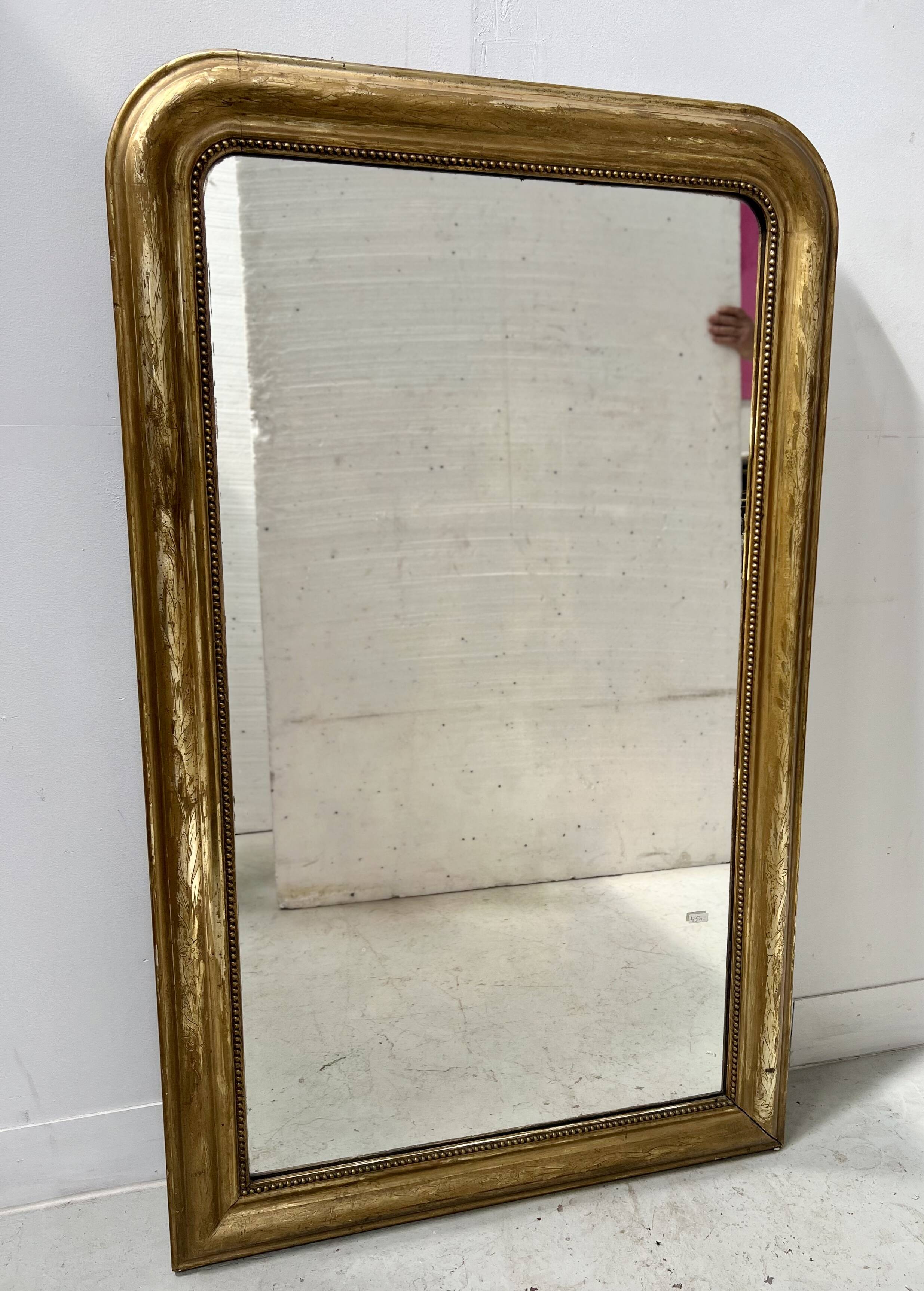 Louis Philippe mirror in wood and gilded stucco, 19th century