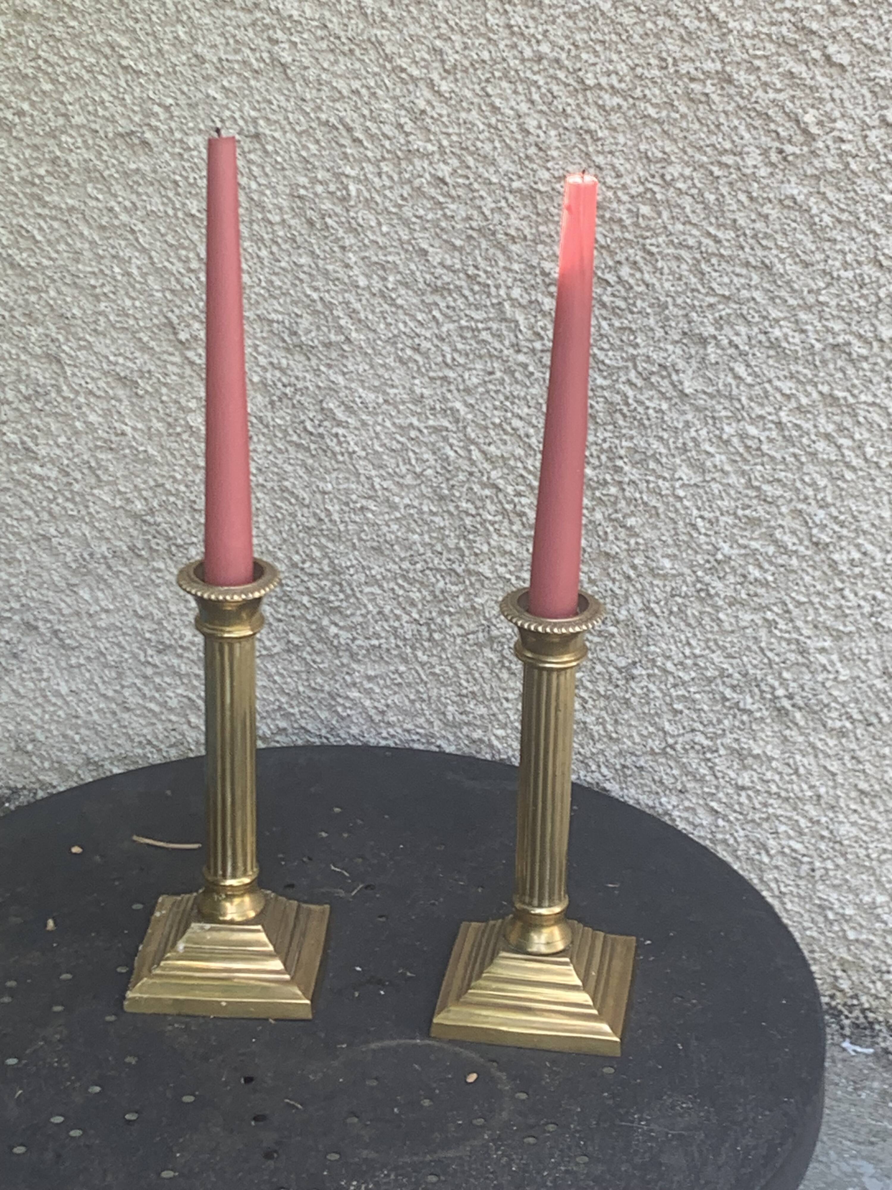 Pair of gilded brass candlesticks, vintage column shape