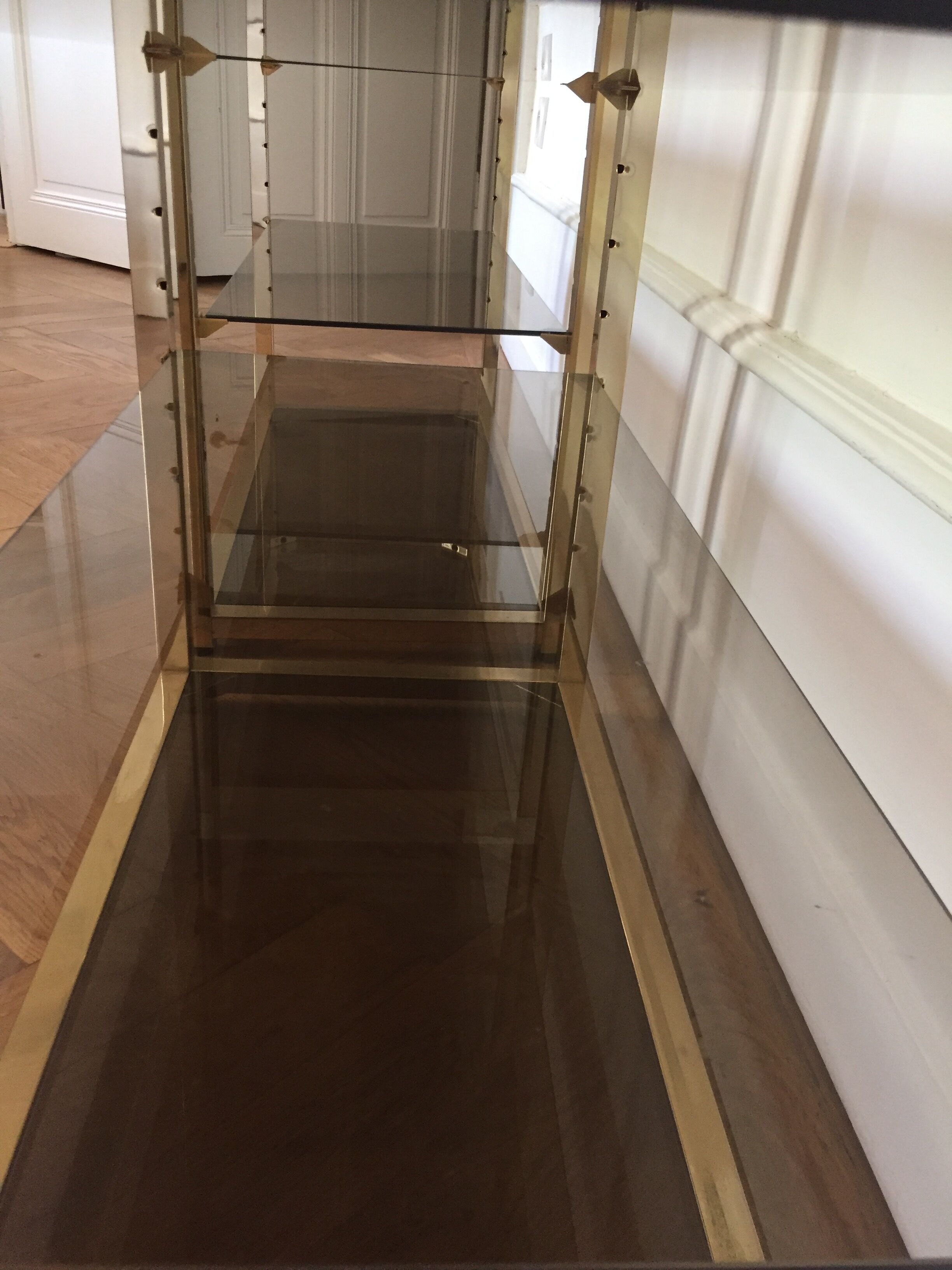 Pair of consoles brass shelves and smoked glass design Roche Bobois