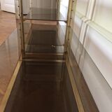 Pair of consoles brass shelves and smoked glass design Roche Bobois