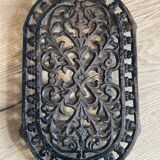Dessous de plat en fonte