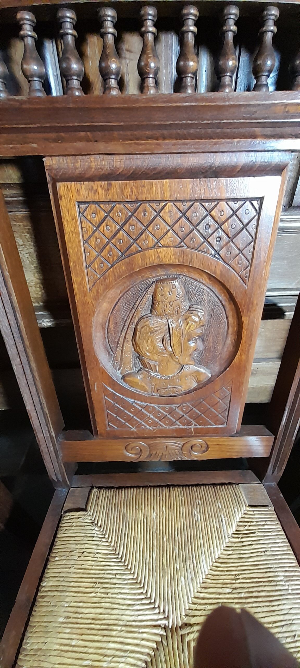 Breton dining room table with 2 extensions and 6 chairs with carved Breton characters