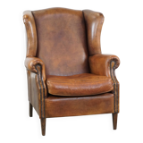Large sheep leather wingback chair correctly finished with decorative nails