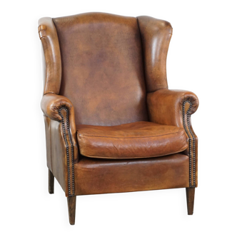 Large sheep leather wingback chair correctly finished with decorative nails