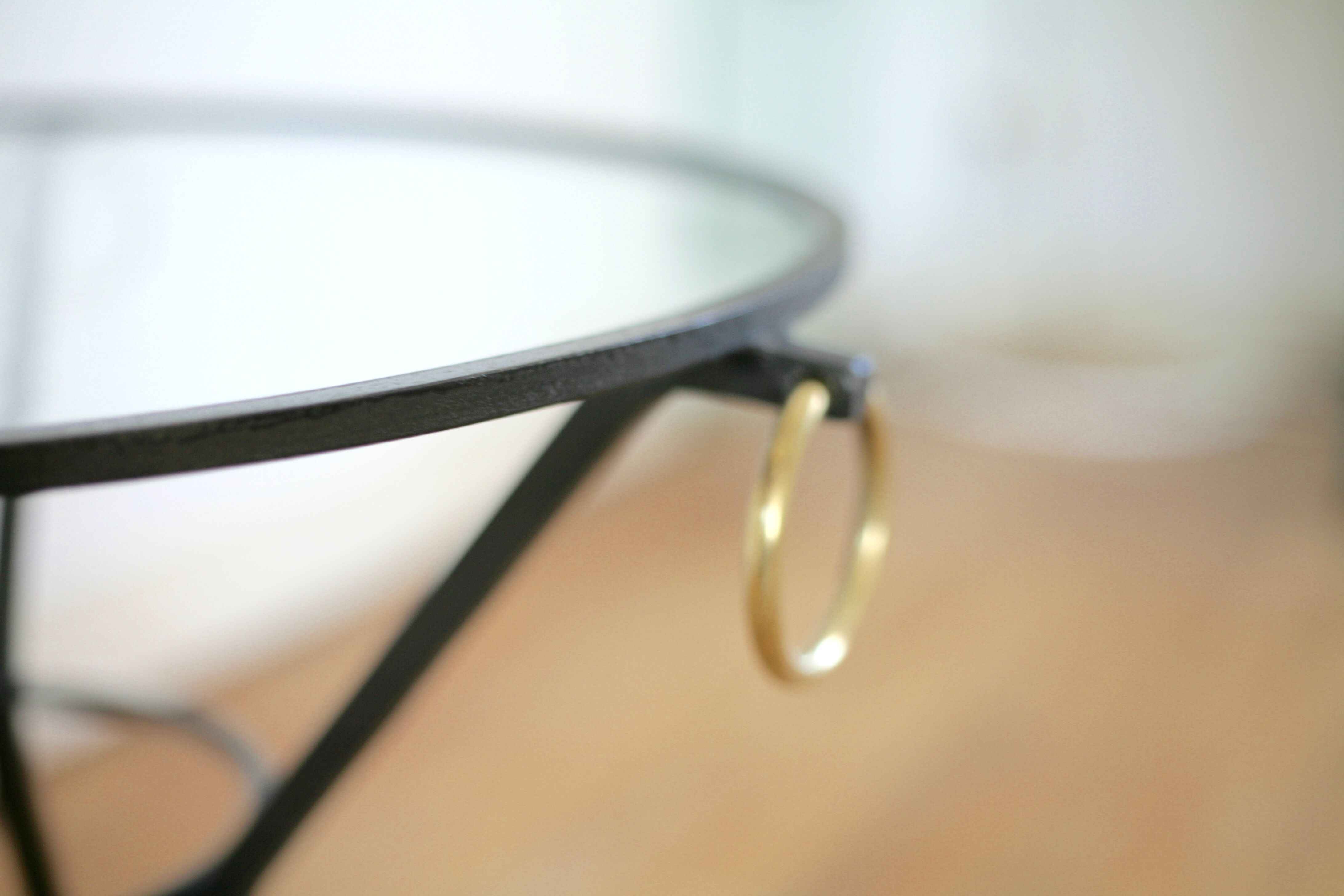 Coffee table black lacquered metal, glass and brass, France, circa 1950.