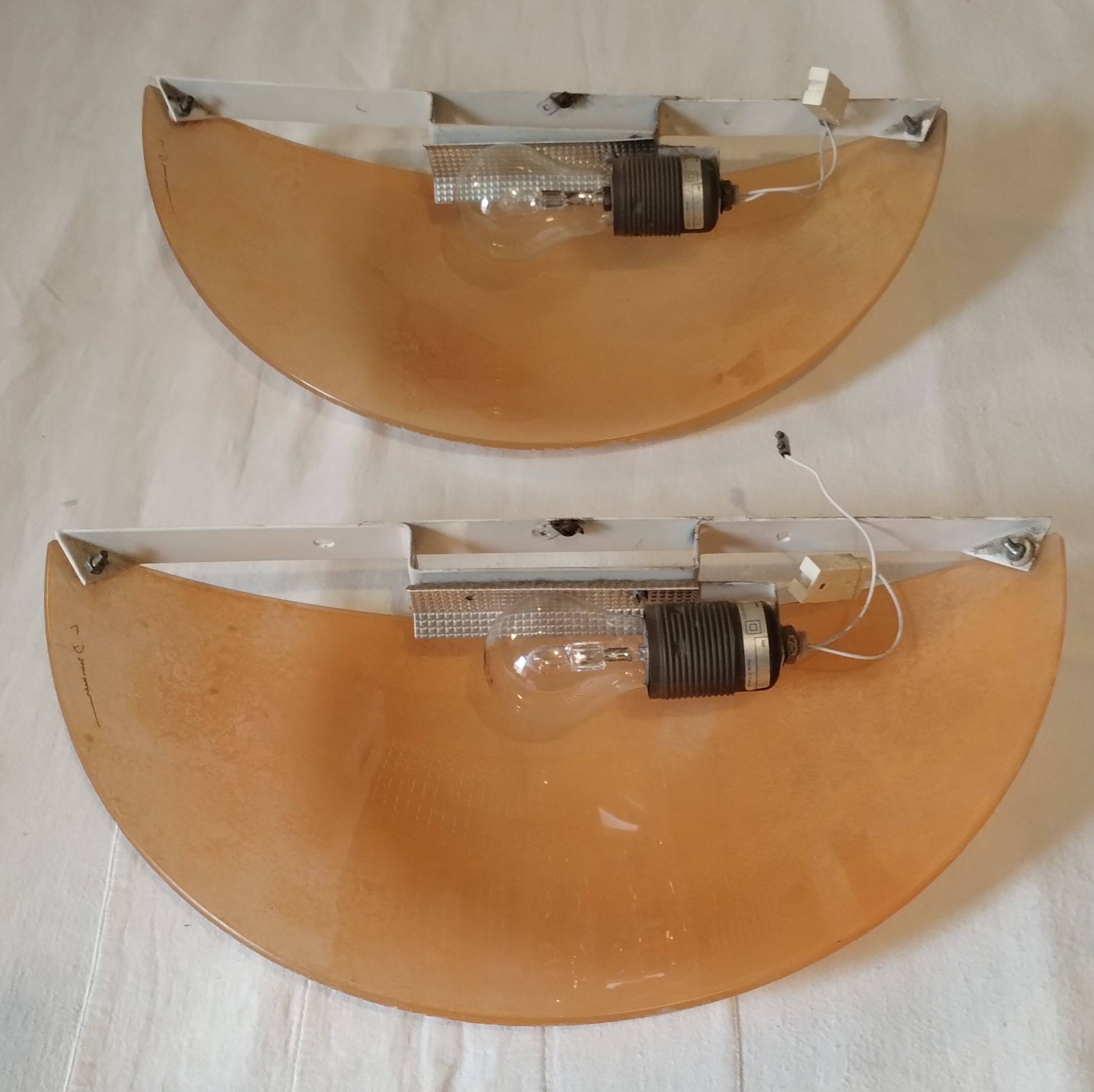 Pair of wall sconces signed L. Drummer