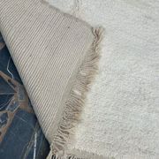 Handmade natural wool rug, size 150 x 250 cm