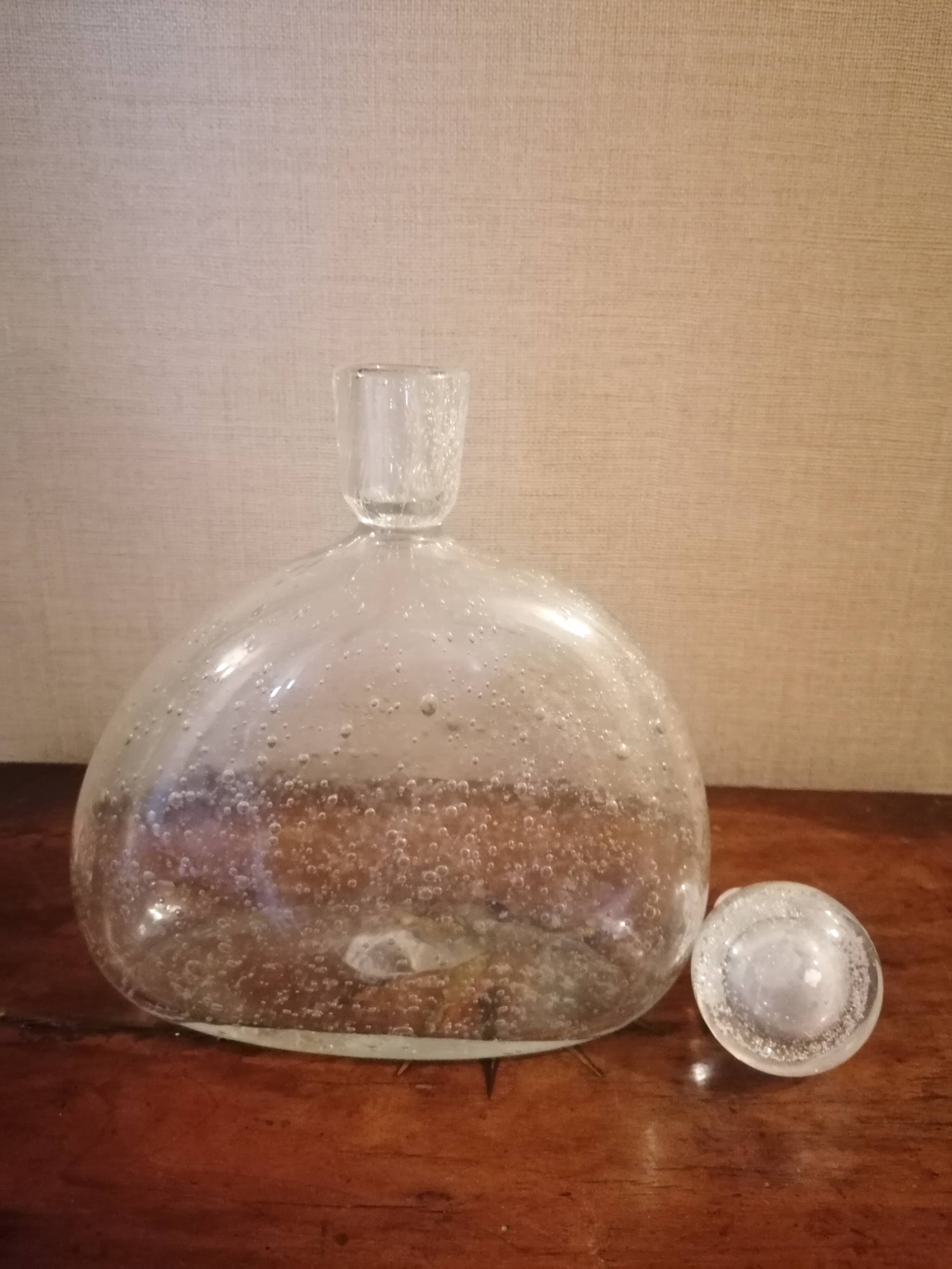 Clear bubble glass bottle molded for easy manual gripping