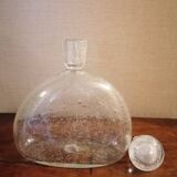 Clear bubble glass bottle molded for easy manual gripping