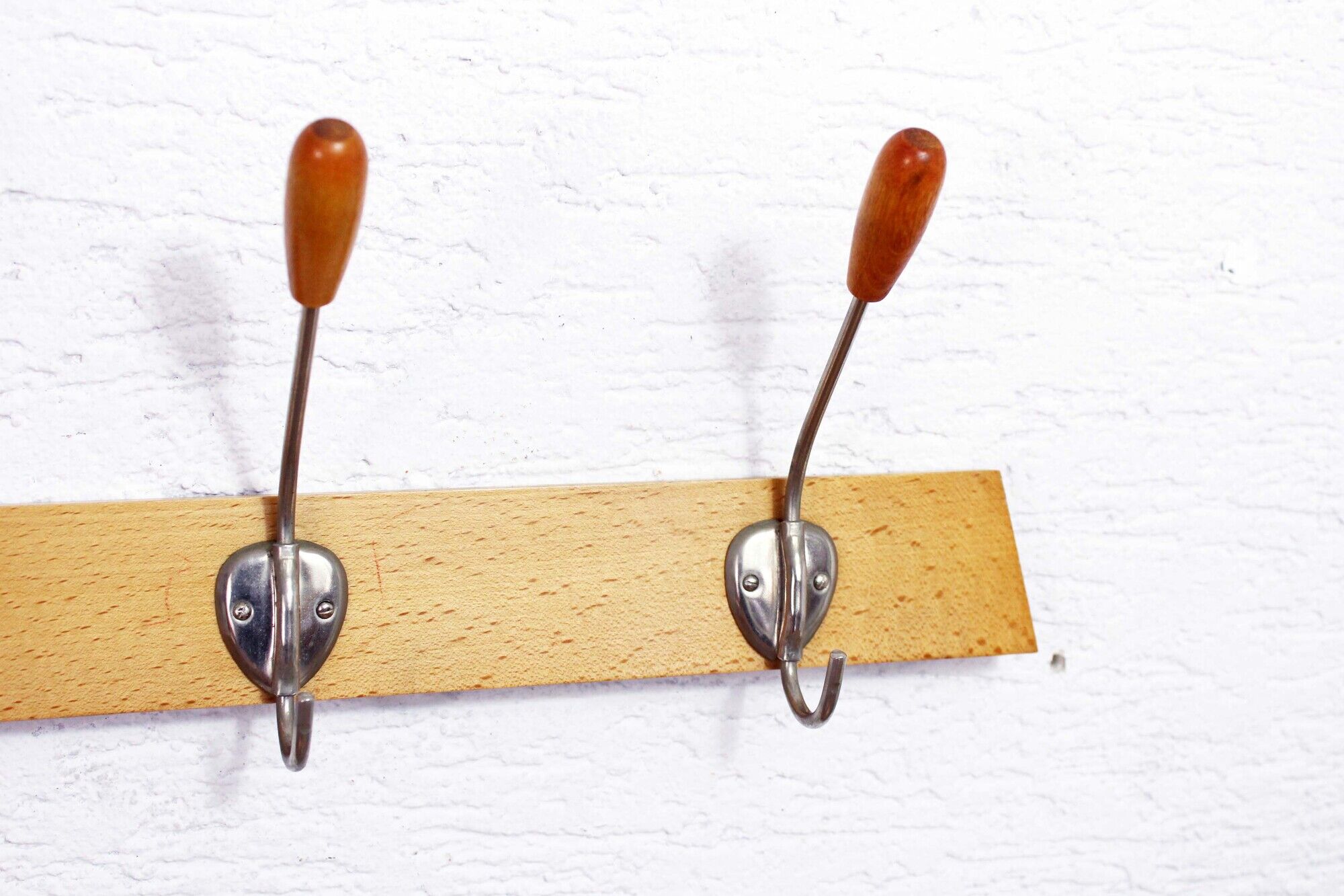Peg wood and metal, wearing vintage coat