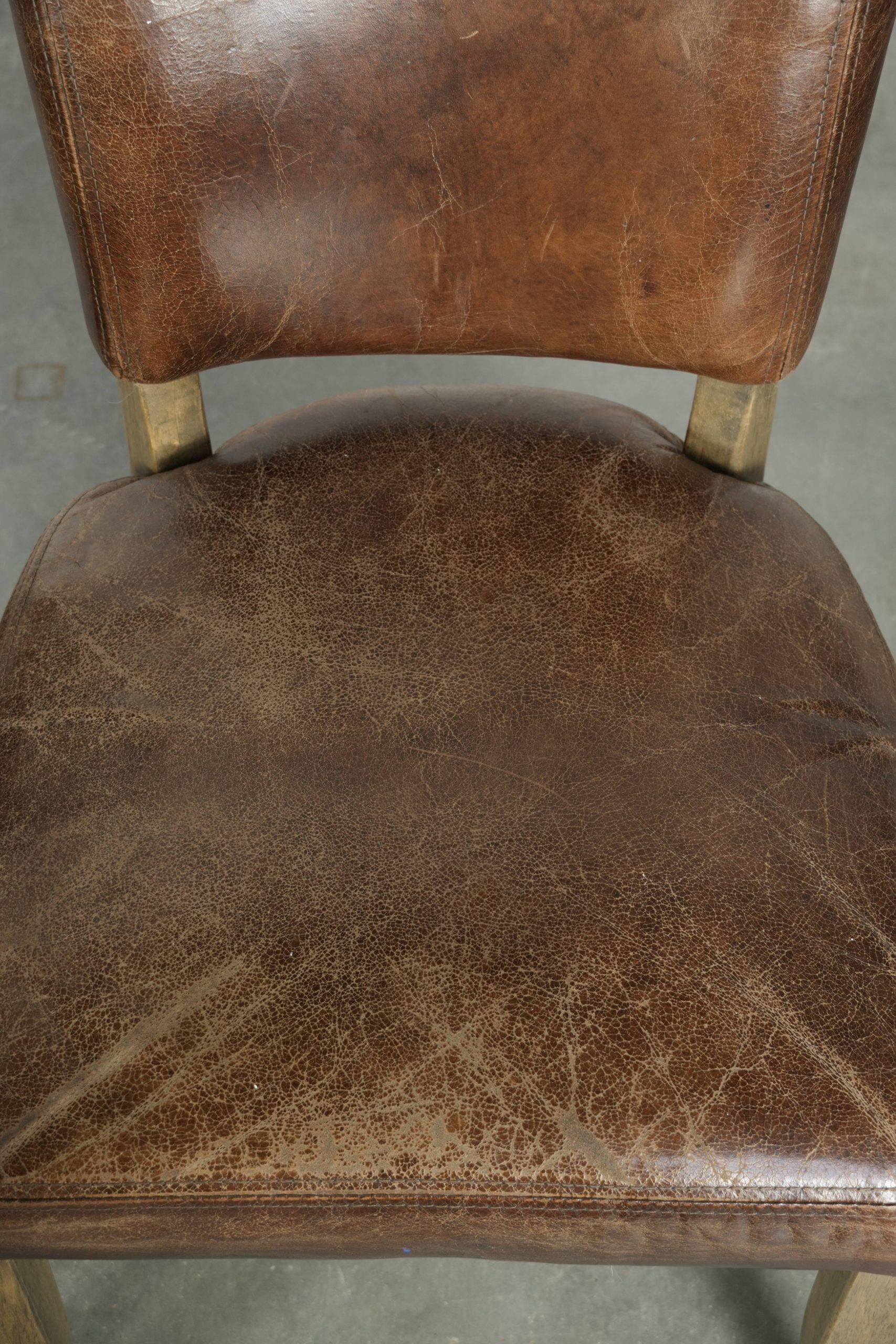 Set of 4 vintage cowhide and wooden dining chairs