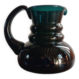 Deep green jug or pitcher with modern design - thick glass
