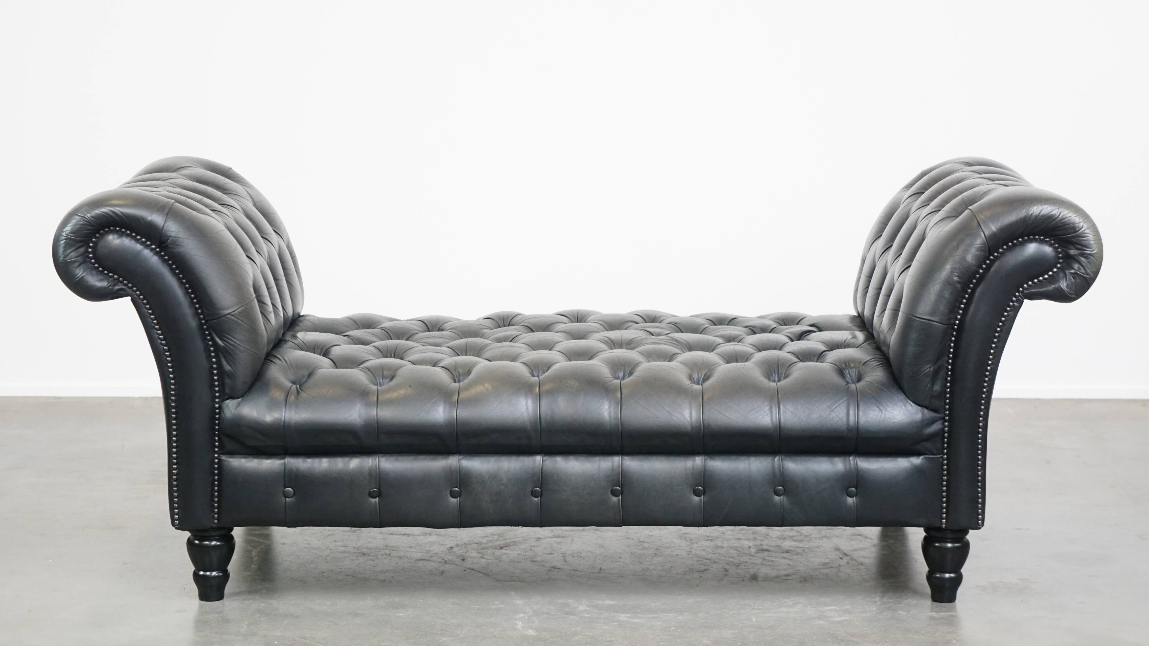 Black chesterfield daybed made of cowhide
