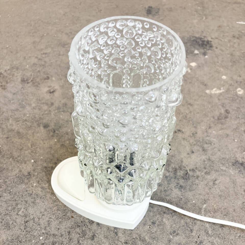 Table lamp by SAKU, glass bag on plastic base, 1970s