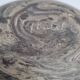 Round ceramic vase with raw finish, smoked firing, signed, late 20th century, 11 cm.