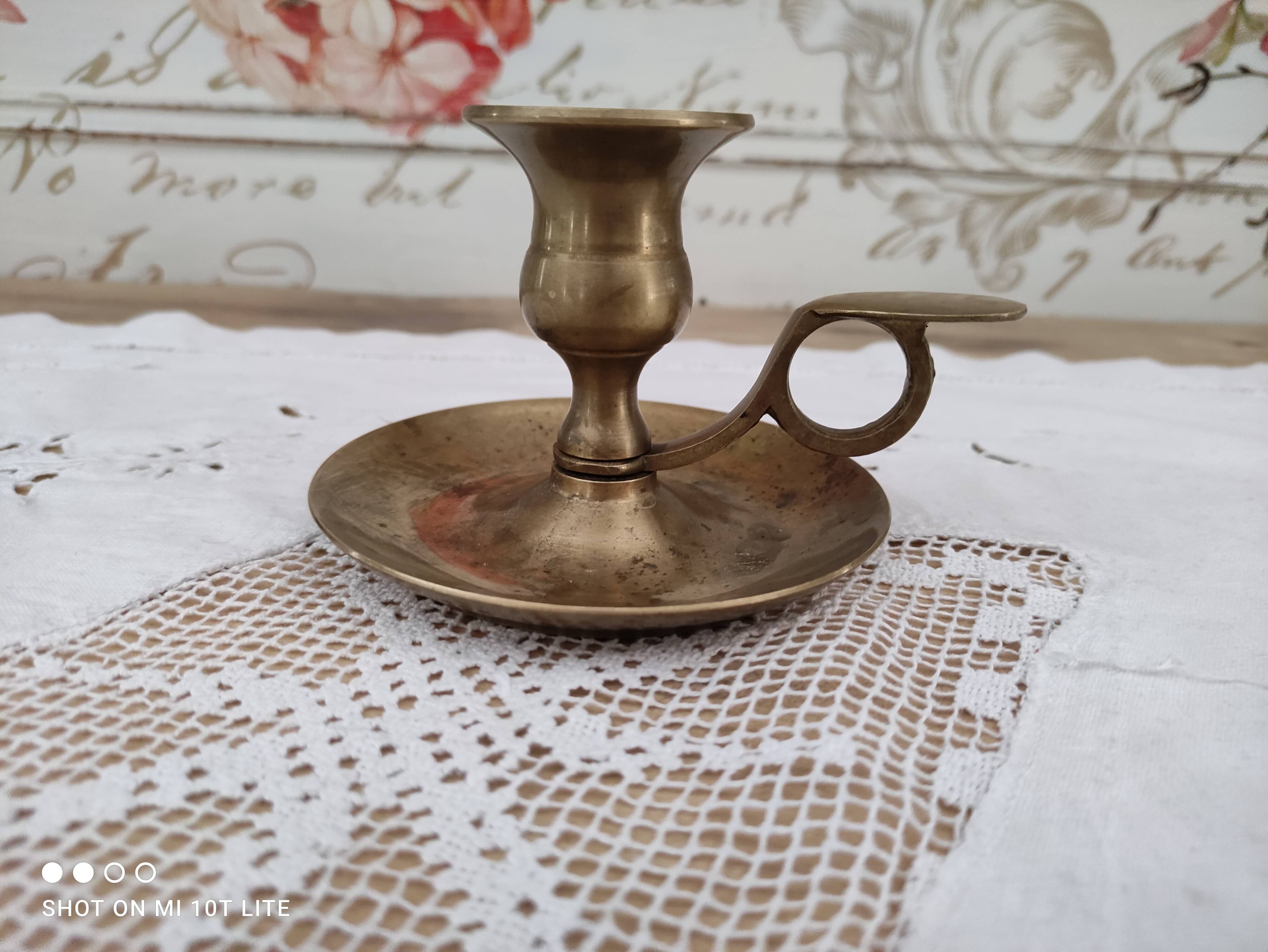 Hand candle holder called cellar rat in solid brass