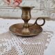 Hand candle holder called cellar rat in solid brass