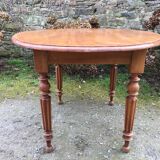 Table ovale ancienne en cerisier pieds parapluie