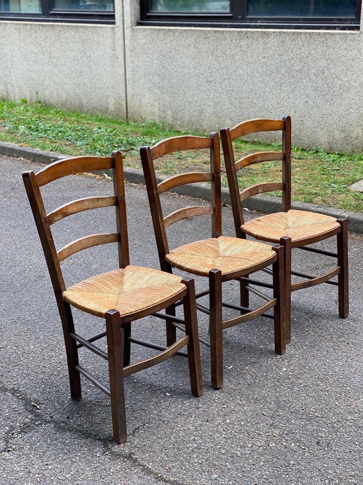 3 solid wood and straw chairs