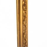 A mirror in a golden frame