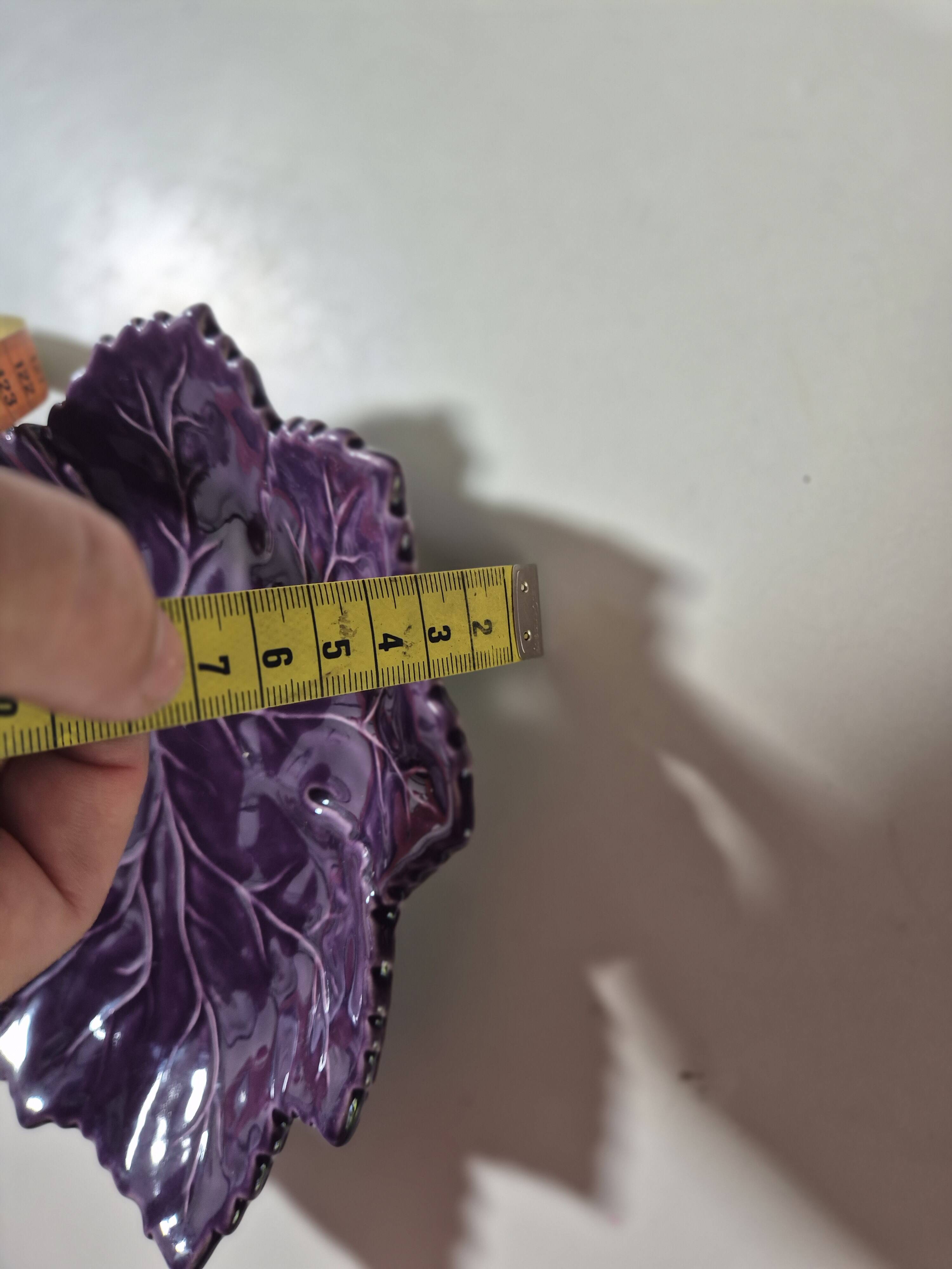 purple ceramic bowl in the shape of a tree leaf