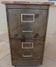 Vintage industrial metal furniture with a rusty effect, featuring two drawers on wheels.
