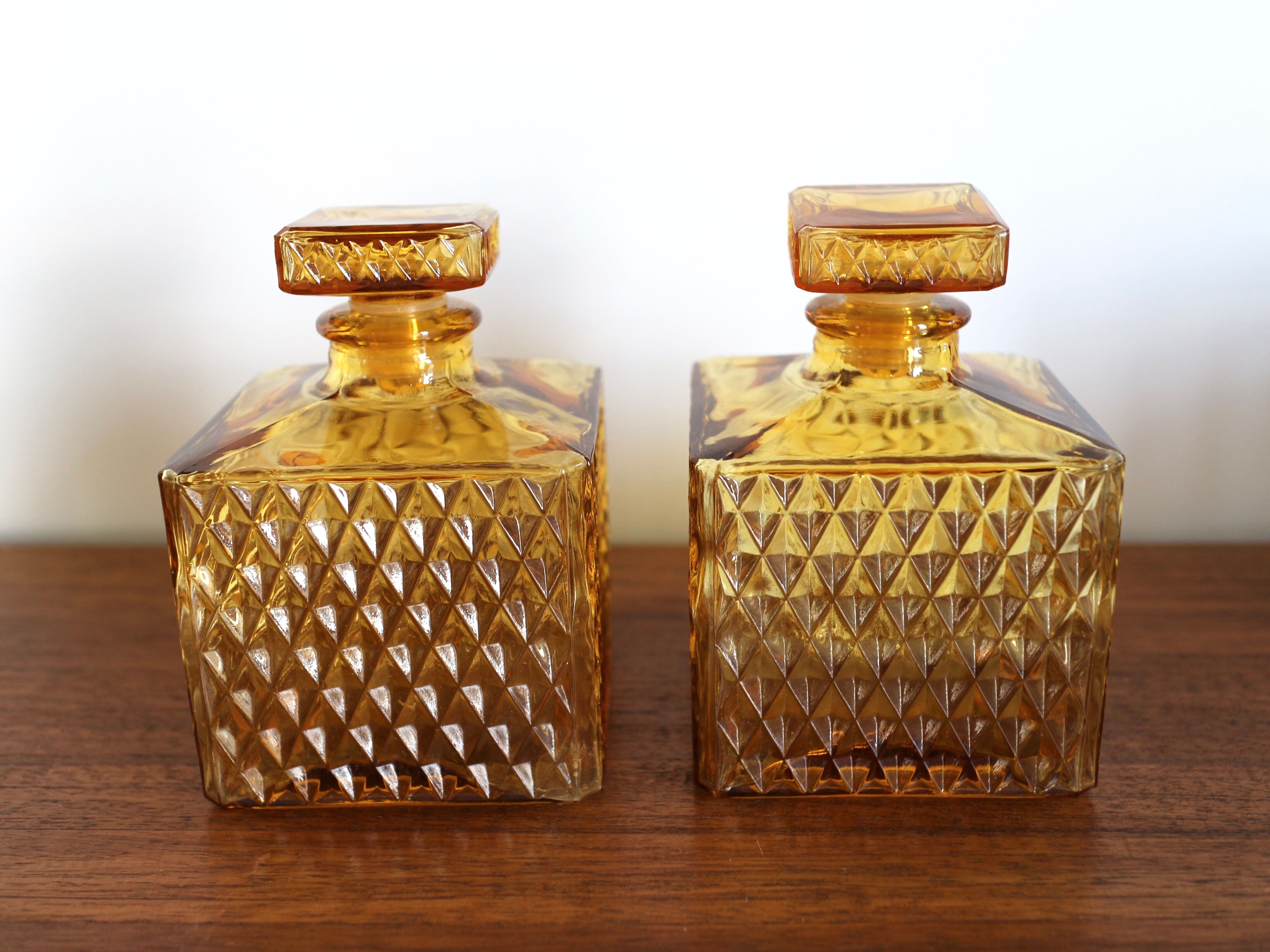 2 yellow glass whiskey carafes