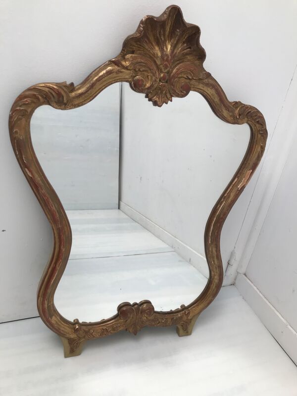 Miroir en bois doré décor coquille Louis XIV
