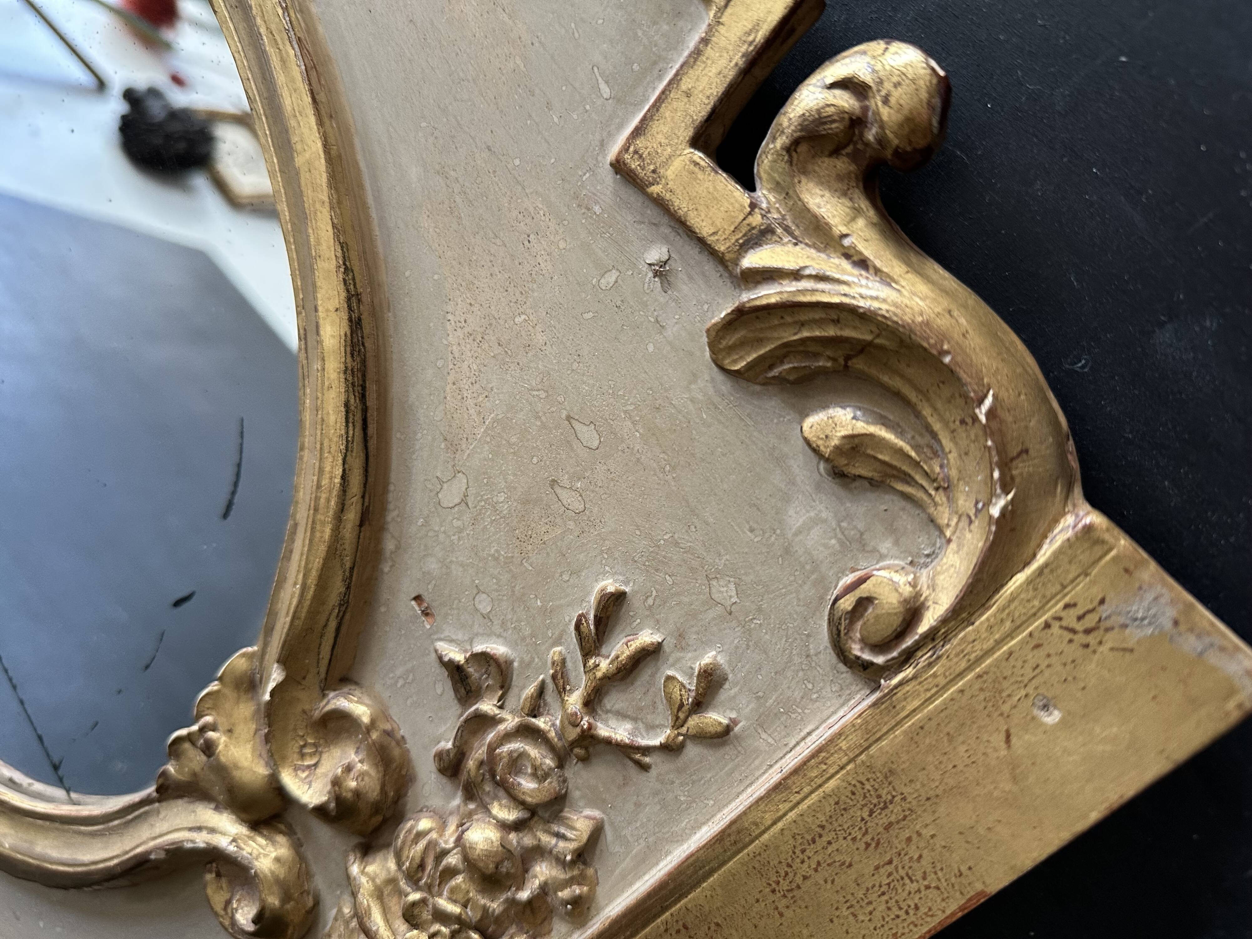 Napoleon III mirror in carved gilded wood, oval mercury glass.