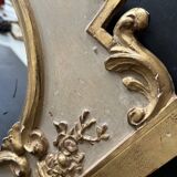 Napoleon III mirror in carved gilded wood, oval mercury glass.