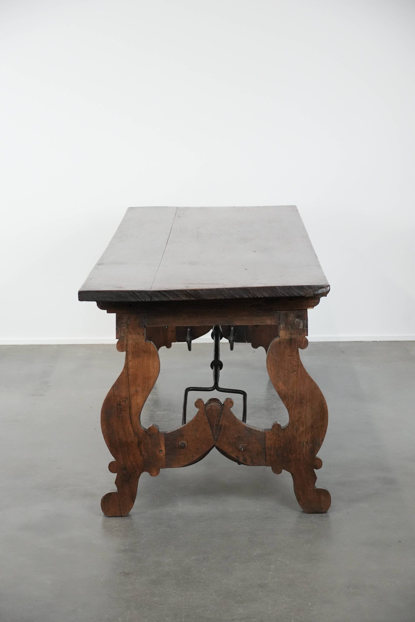 Antique 18th-century Spanish dining table with a wrought iron base
