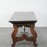 Antique 18th-century Spanish dining table with a wrought iron base
