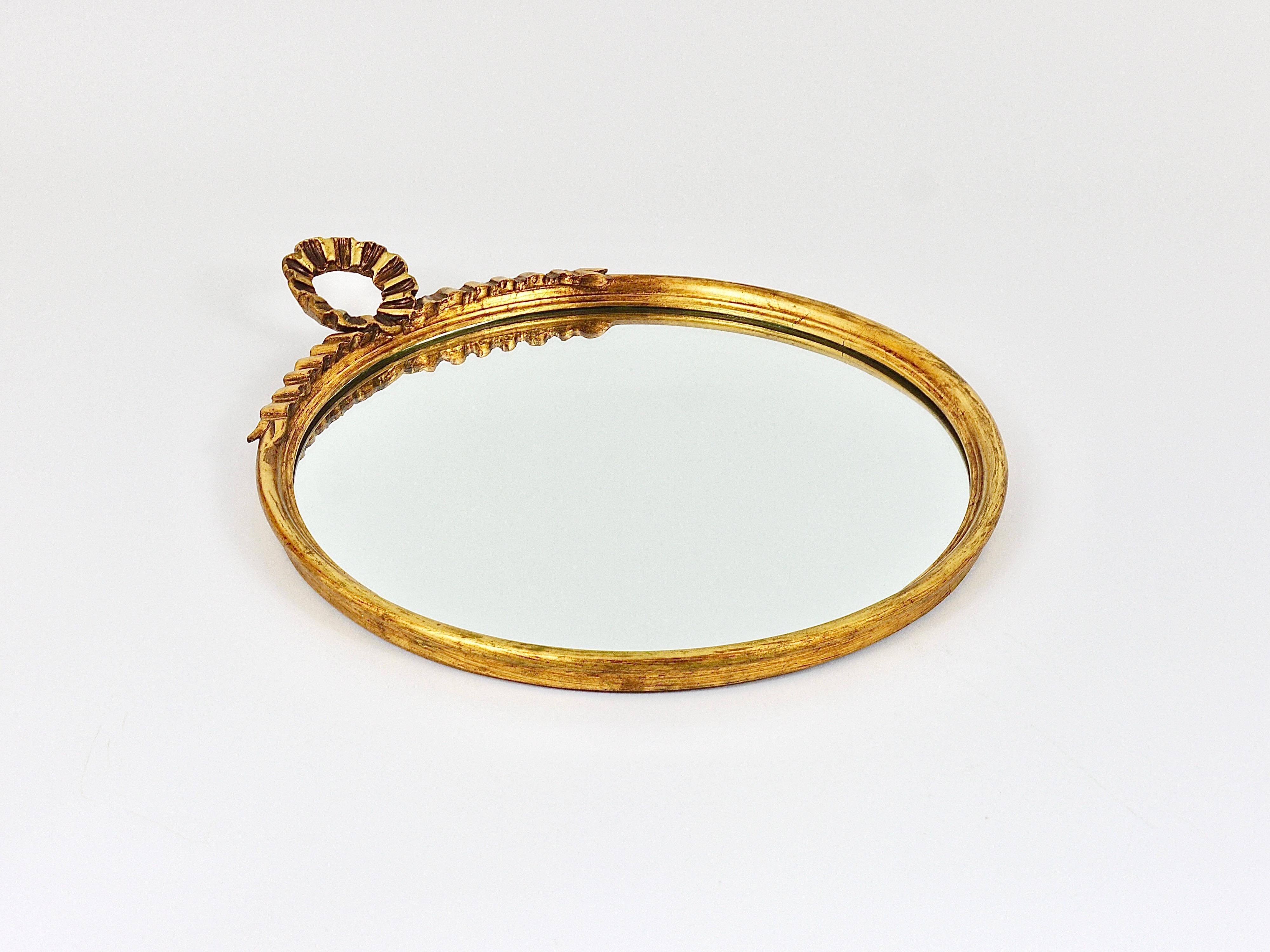 Round wall mirror in gilded wood, mid-century, C. Allodi & G. Subelli, Italy, 1950s.