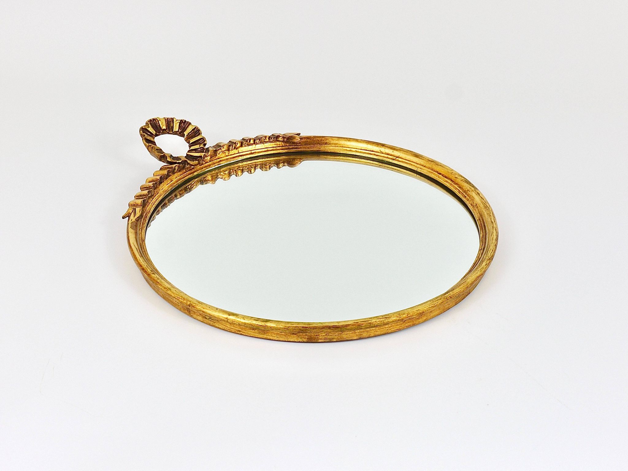Round wall mirror in gilded wood, mid-century, C. Allodi & G. Subelli, Italy, 1950s.