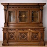 Two-body buffet, made of richly carved solid walnut.